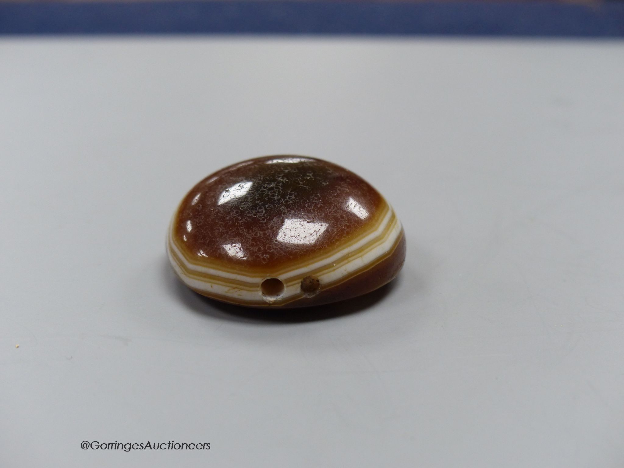 A cased agate pendant